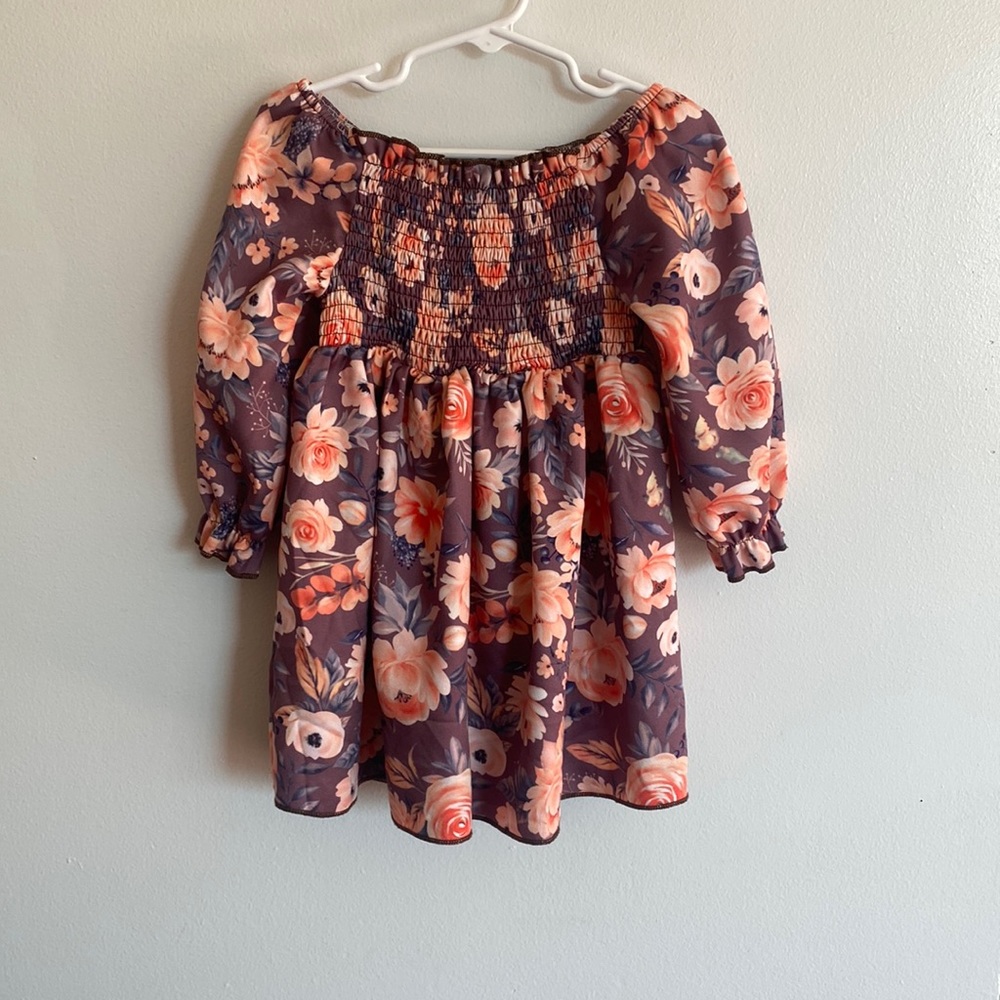 Girl’s off the shoulder floral dress.